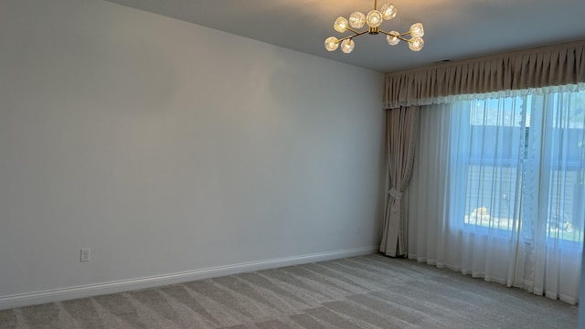 717 Angels Rest Way, Columbia, MO 65203 - spare room featuring a chandelier and light carpet