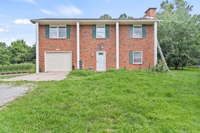 3601 W Hilltop Dr, Columbia, MO 65203 - view of front of house with driveway, a chimney, brick siding, and a garage