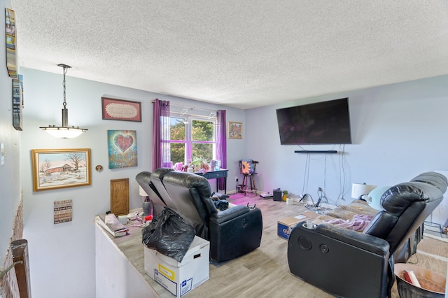 3601 W Hilltop Dr, Columbia, MO 65203 - living area featuring a textured ceiling and wood finished floors