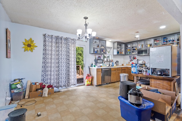 3601 W Hilltop Dr, Columbia, MO 65203 - kitchen with stainless steel appliances, open shelves, a textured ceiling, a chandelier, and light countertops