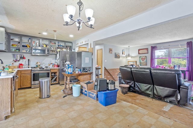 3601 W Hilltop Dr, Columbia, MO 65203 - miscellaneous room with a textured ceiling, a chandelier, and light floors