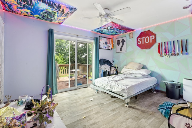 3601 W Hilltop Dr, Columbia, MO 65203 - bedroom featuring access to outside, wood finished floors, and a ceiling fan