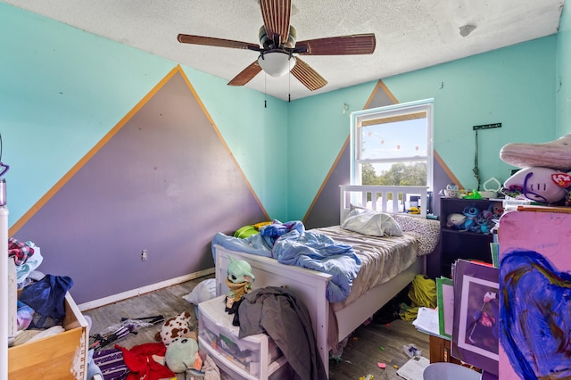 3601 W Hilltop Dr, Columbia, MO 65203 - bedroom with wood finished floors, a textured ceiling, and ceiling fan