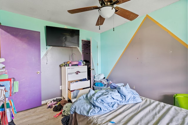 3601 W Hilltop Dr, Columbia, MO 65203 - bedroom with wood finished floors and a ceiling fan
