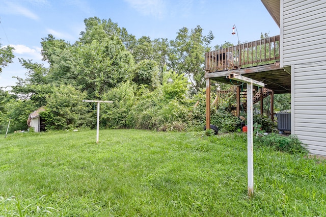 3601 W Hilltop Dr, Columbia, MO 65203 - view of grassy yard featuring a wooden deck and stairs