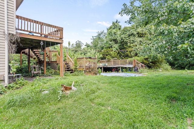 3601 W Hilltop Dr, Columbia, MO 65203 - view of green lawn featuring a wooden deck and stairs