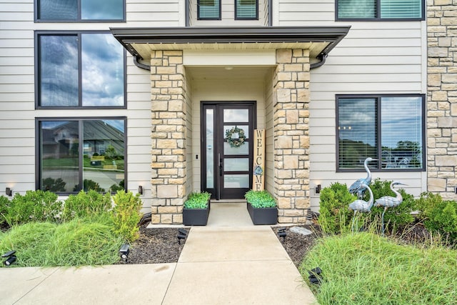 613 Red Feather Ct, Columbia, MO 65203 - property entrance featuring stone siding