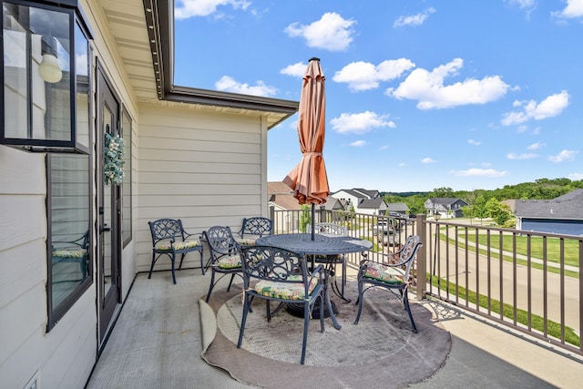613 Red Feather Ct, Columbia, MO 65203 - patio / terrace featuring outdoor dining space and a residential view