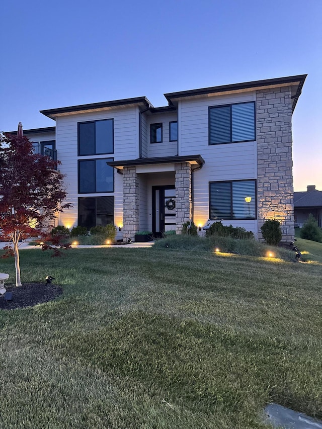 613 Red Feather Ct, Columbia, MO 65203 - view of front of house with stone siding and a front lawn