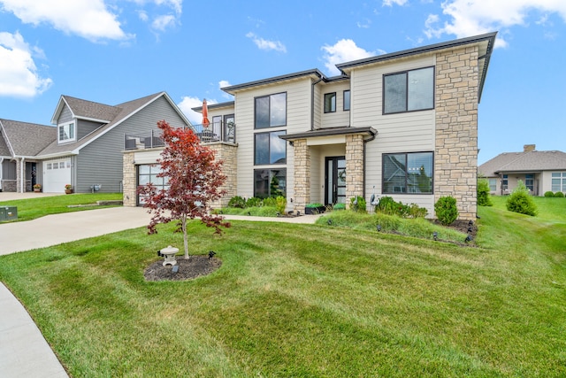 613 Red Feather Ct, Columbia, MO 65203 - view of front facade featuring stone siding, concrete driveway, a front lawn, and an attached garage