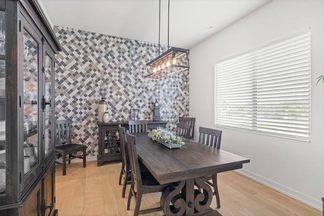 613 Red Feather Ct, Columbia, MO 65203 - dining area with an accent wall and light wood-type flooring