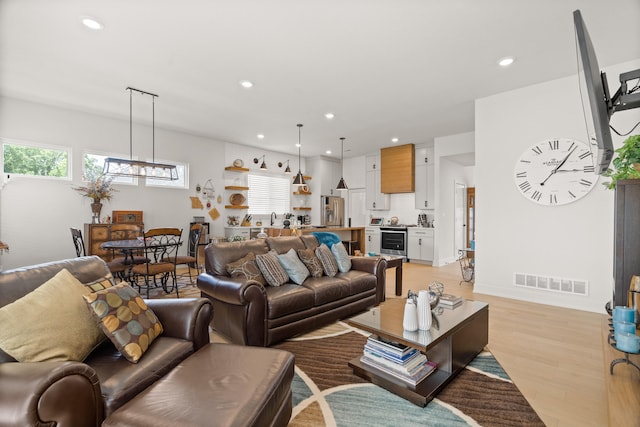 613 Red Feather Ct, Columbia, MO 65203 - living area with recessed lighting, light wood-style floors, and a chandelier