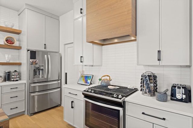 613 Red Feather Ct, Columbia, MO 65203 - kitchen with stainless steel appliances, premium range hood, light countertops, tasteful backsplash, and open shelves