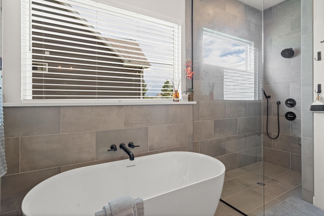 613 Red Feather Ct, Columbia, MO 65203 - full bathroom with a soaking tub, a tile shower, and tile walls