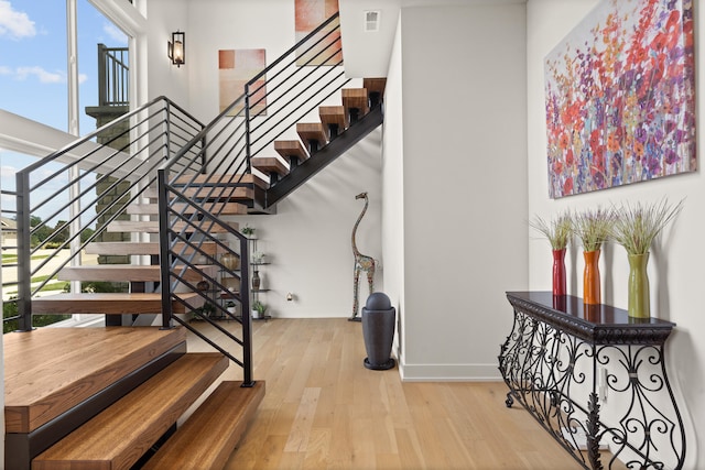 613 Red Feather Ct, Columbia, MO 65203 - staircase featuring wood finished floors and healthy amount of natural light