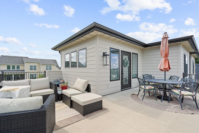 613 Red Feather Ct, Columbia, MO 65203 - view of patio featuring an outdoor living space and outdoor dining area