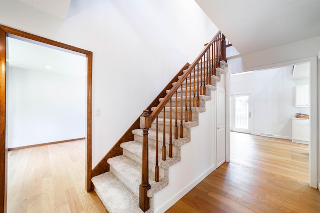 3112 Crestwood Ln, Columbia, MO 65203 - stairs with wood finished floors and baseboards