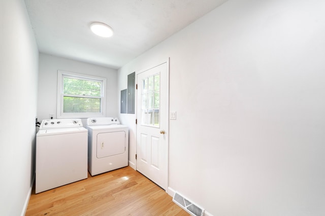 3112 Crestwood Ln, Columbia, MO 65203 - washroom with washer and dryer and light wood-style flooring