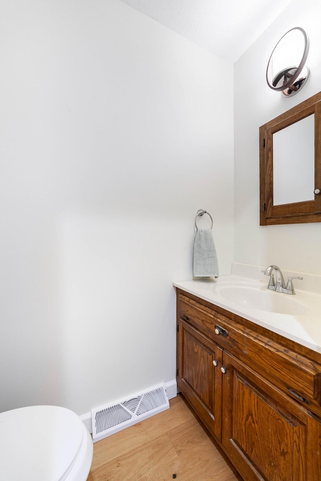 3112 Crestwood Ln, Columbia, MO 65203 - bathroom with vanity and wood finished floors
