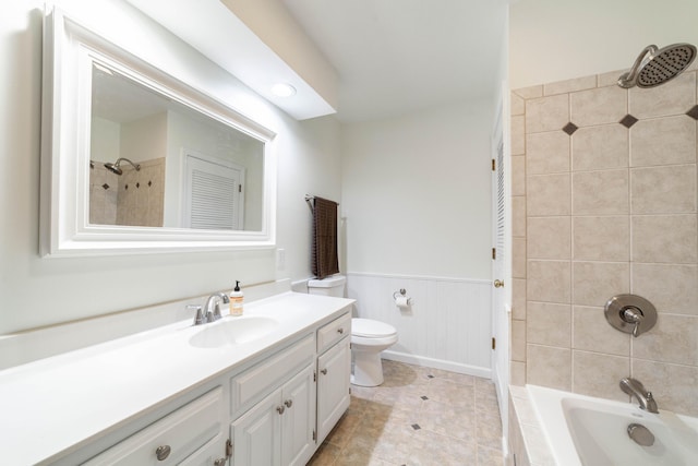 3112 Crestwood Ln, Columbia, MO 65203 - bathroom with vanity, a wainscoted wall, tiled shower / bath, and tile patterned floors