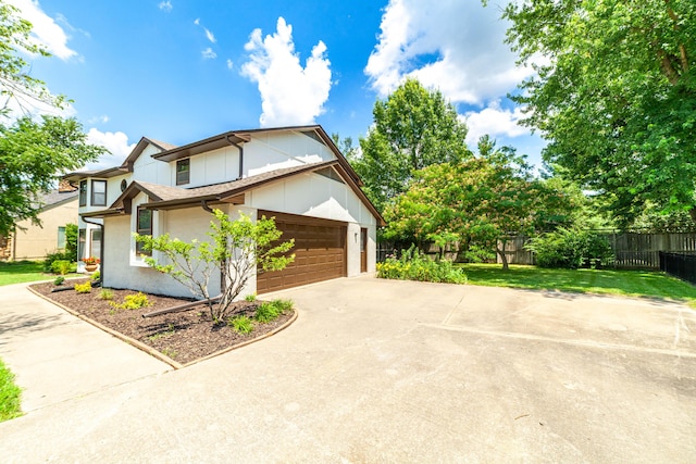 3112 Crestwood Ln, Columbia, MO 65203 - view of home's exterior with concrete driveway, a garage, and board and batten siding