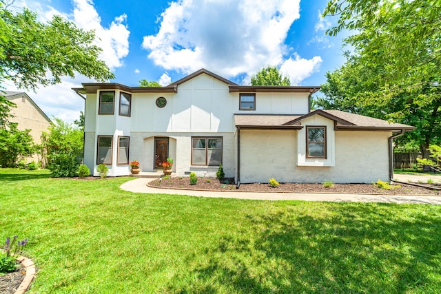 3112 Crestwood Ln, Columbia, MO 65203 - view of front of home with a front yard, brick siding, and roof with shingles