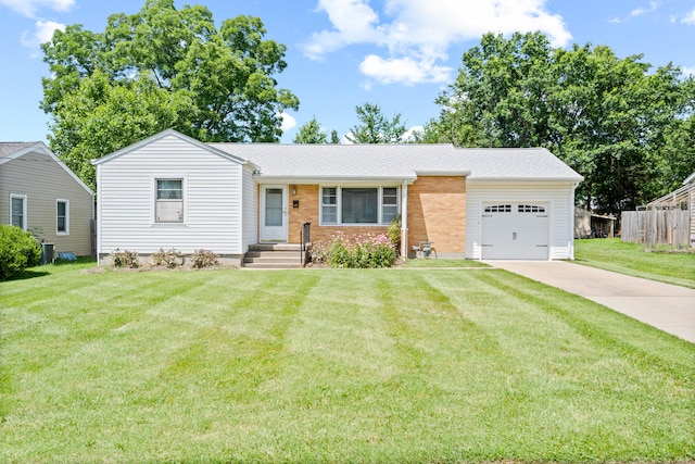 709 Clayton St, Columbia, MO 65203 - ranch-style house with an attached garage, driveway, brick siding, and roof with shingles