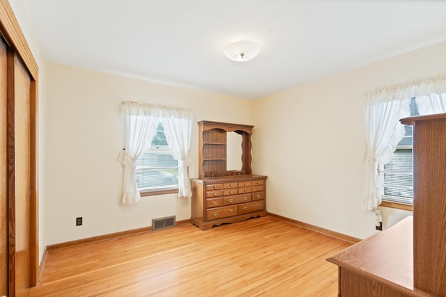 709 Clayton St, Columbia, MO 65203 - unfurnished bedroom with light wood-style flooring and a closet