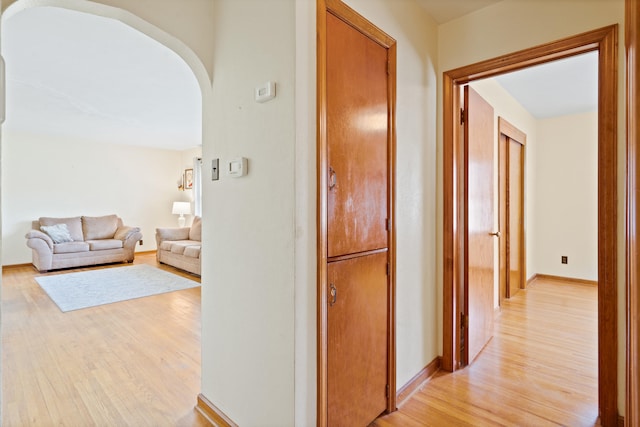 709 Clayton St, Columbia, MO 65203 - corridor with arched walkways and light wood-style flooring