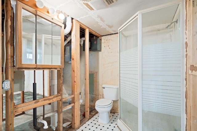 709 Clayton St, Columbia, MO 65203 - bathroom featuring toilet and a shower stall
