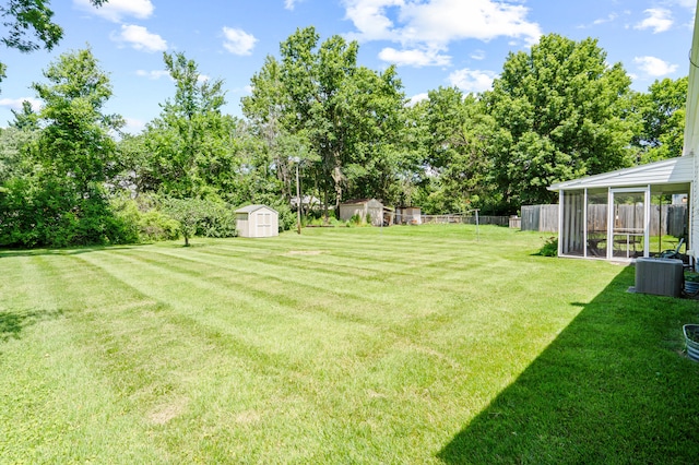 709 Clayton St, Columbia, MO 65203 - view of yard with a shed and view of wooded area