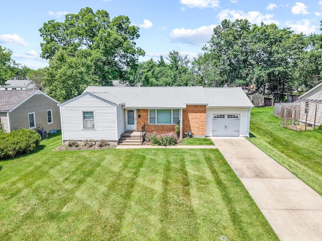 709 Clayton St, Columbia, MO 65203 - view of front of home with a garage, concrete driveway, a front lawn, brick siding, and roof with shingles