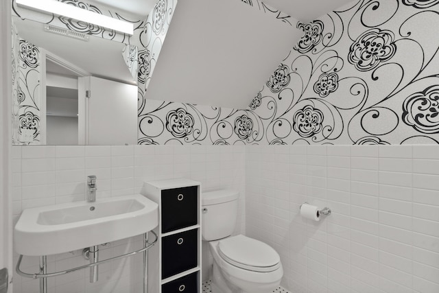 702 Russell Blvd, Columbia, MO 65203 - half bath with tile walls and toilet