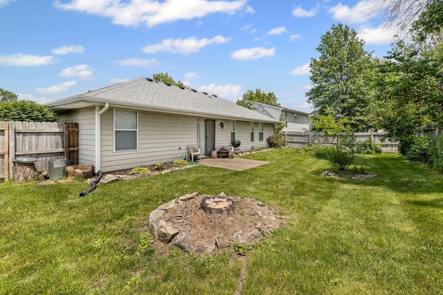 3628 Lupine Dr, Columbia, MO 65201 - rear view of house featuring a patio area, a fenced backyard, a fire pit, and a shingled roof