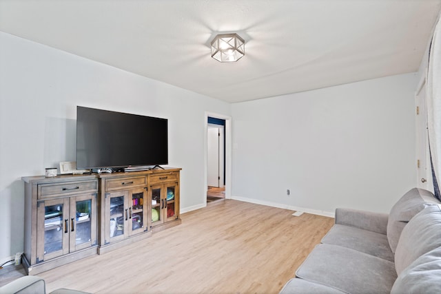 1305 Sims St, Columbia, MO 65201 - living room with wood finished floors and baseboards
