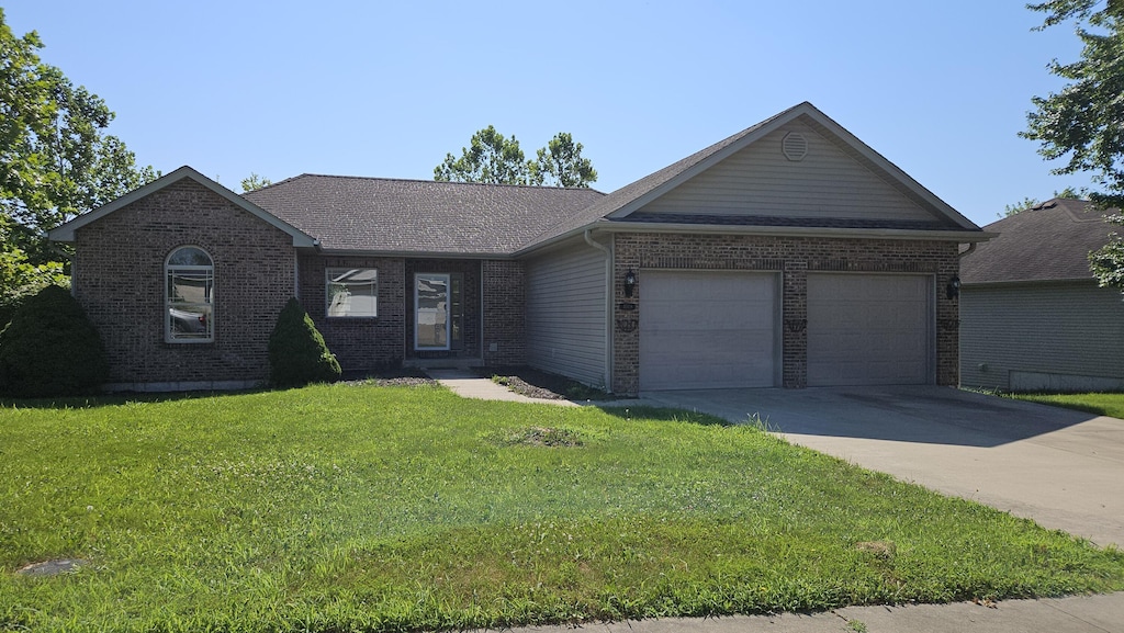 4008 Iguana Dr, Columbia, MO 65202 - single story home with brick siding, a garage, driveway, and a front yard