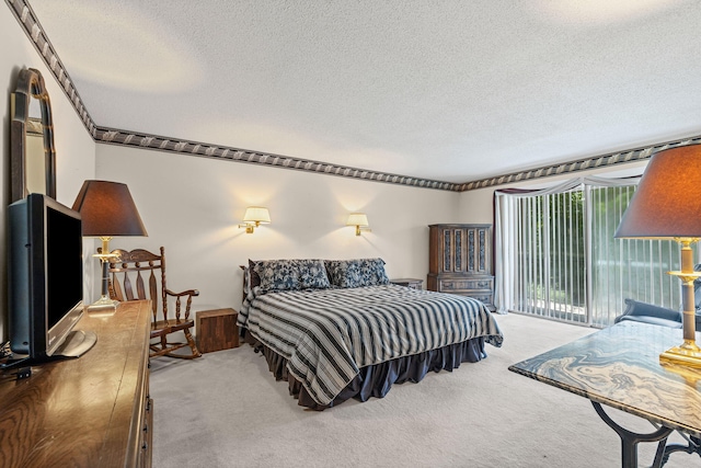 2710 Rollins Rd Unit A-1, Columbia, MO 65203 - bedroom with a textured ceiling, carpet, and access to exterior