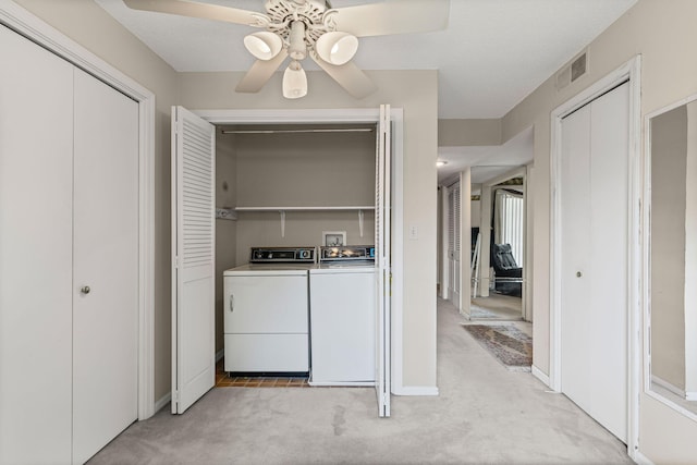 2710 Rollins Rd Unit A-1, Columbia, MO 65203 - washroom featuring washing machine and clothes dryer, a ceiling fan, and light carpet