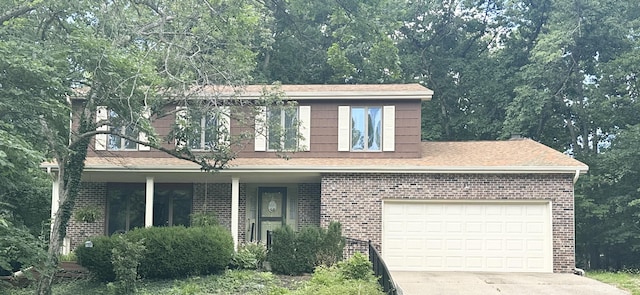 3707 Woodridge Ct, Columbia, MO 65201 - view of front of house with brick siding, driveway, and a shingled roof
