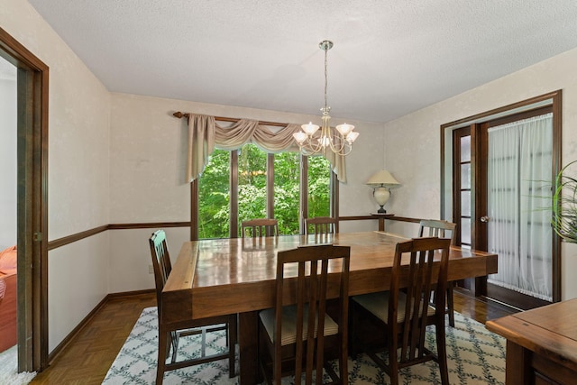 3707 Woodridge Ct, Columbia, MO 65201 - dining area with a textured ceiling and a chandelier