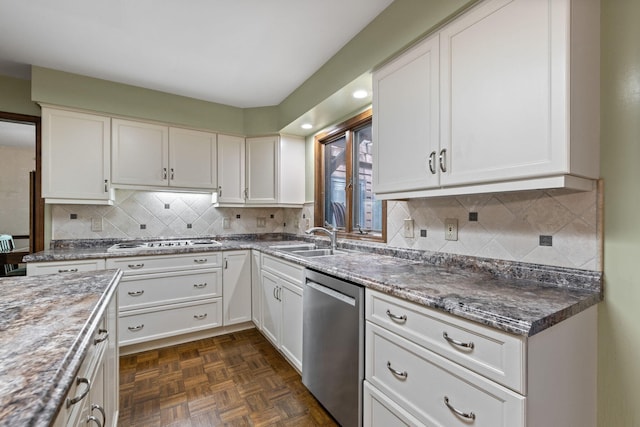 3707 Woodridge Ct, Columbia, MO 65201 - kitchen with stainless steel dishwasher, white cabinets, white gas stovetop, backsplash, and recessed lighting