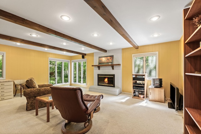 3707 Woodridge Ct, Columbia, MO 65201 - carpeted living area featuring a fireplace, beam ceiling, recessed lighting, and a decorative wall