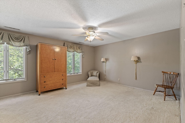 3707 Woodridge Ct, Columbia, MO 65201 - living area with a ceiling fan, healthy amount of natural light, carpet flooring, and a textured ceiling
