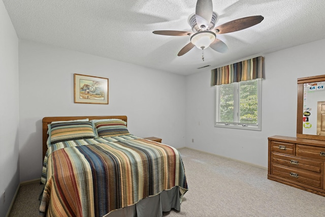 3707 Woodridge Ct, Columbia, MO 65201 - carpeted bedroom with a textured ceiling and ceiling fan