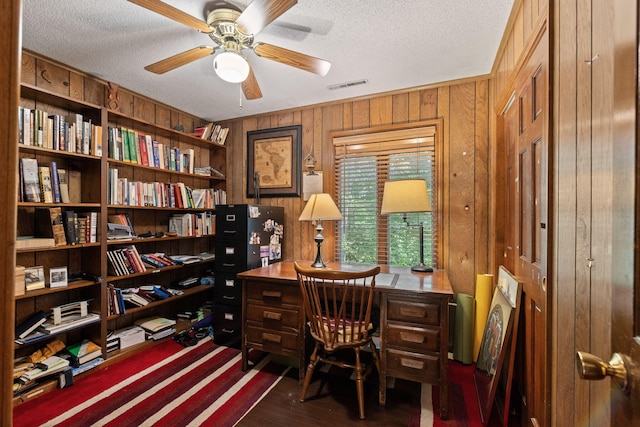 3707 Woodridge Ct, Columbia, MO 65201 - office space with wood walls, a textured ceiling, a ceiling fan, and dark wood-style flooring