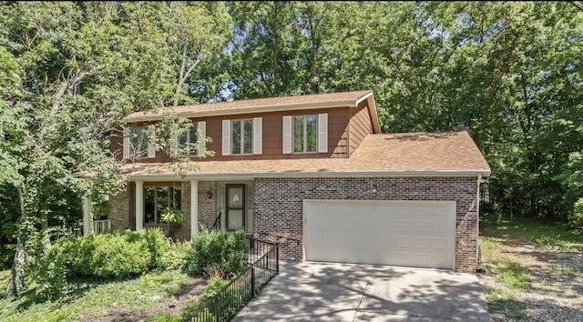 3707 Woodridge Ct, Columbia, MO 65201 - view of front of home featuring driveway, an attached garage, brick siding, and a shingled roof