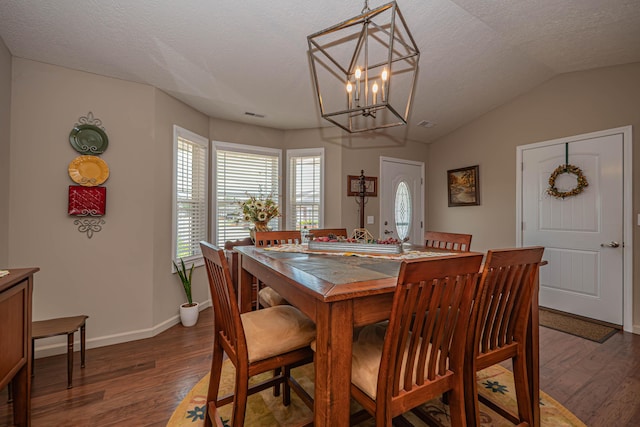 1331 Lantern Pointe Dr, Moberly, MO 65270 - dining space featuring wood finished floors, a textured ceiling, a chandelier, and vaulted ceiling