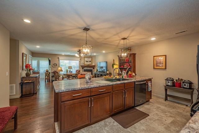 1331 Lantern Pointe Dr, Moberly, MO 65270 - kitchen featuring stainless steel dishwasher, open floor plan, a fireplace, pendant lighting, and recessed lighting