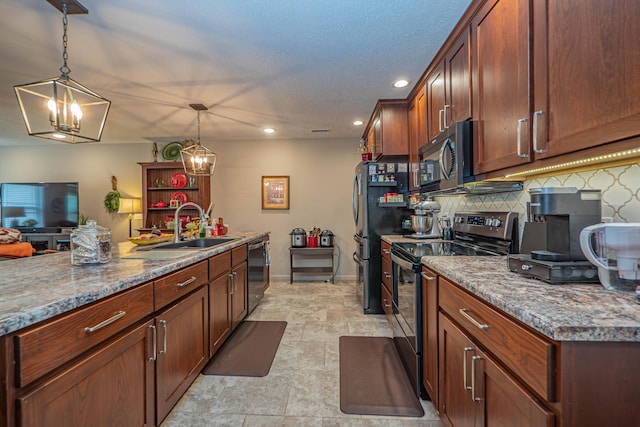 1331 Lantern Pointe Dr, Moberly, MO 65270 - kitchen with appliances with stainless steel finishes, tasteful backsplash, recessed lighting, pendant lighting, and light stone countertops