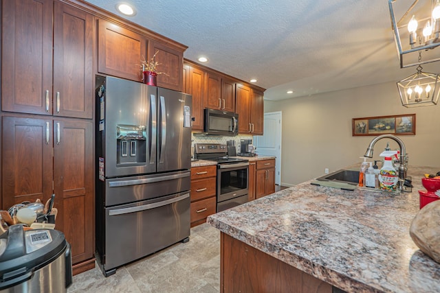 1331 Lantern Pointe Dr, Moberly, MO 65270 - kitchen featuring stainless steel appliances, recessed lighting, decorative backsplash, decorative light fixtures, and a chandelier